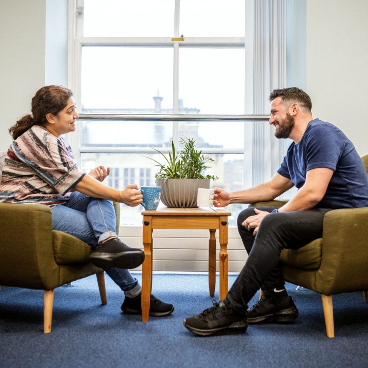 Man and woman in one to one support at Bradford District and Craven Mind